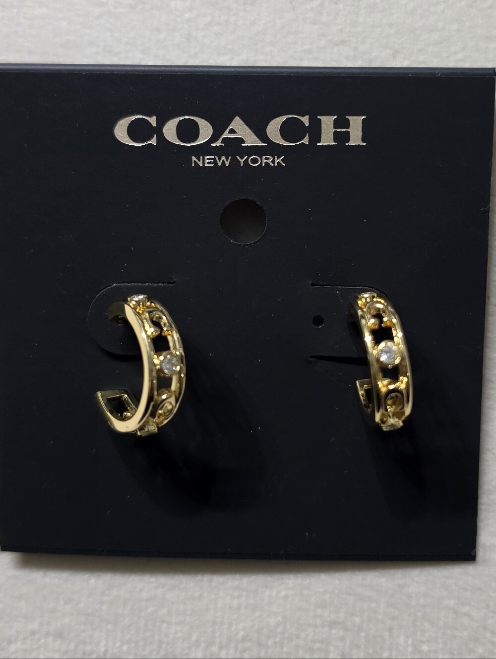 COACH Gold Huggie Earrings